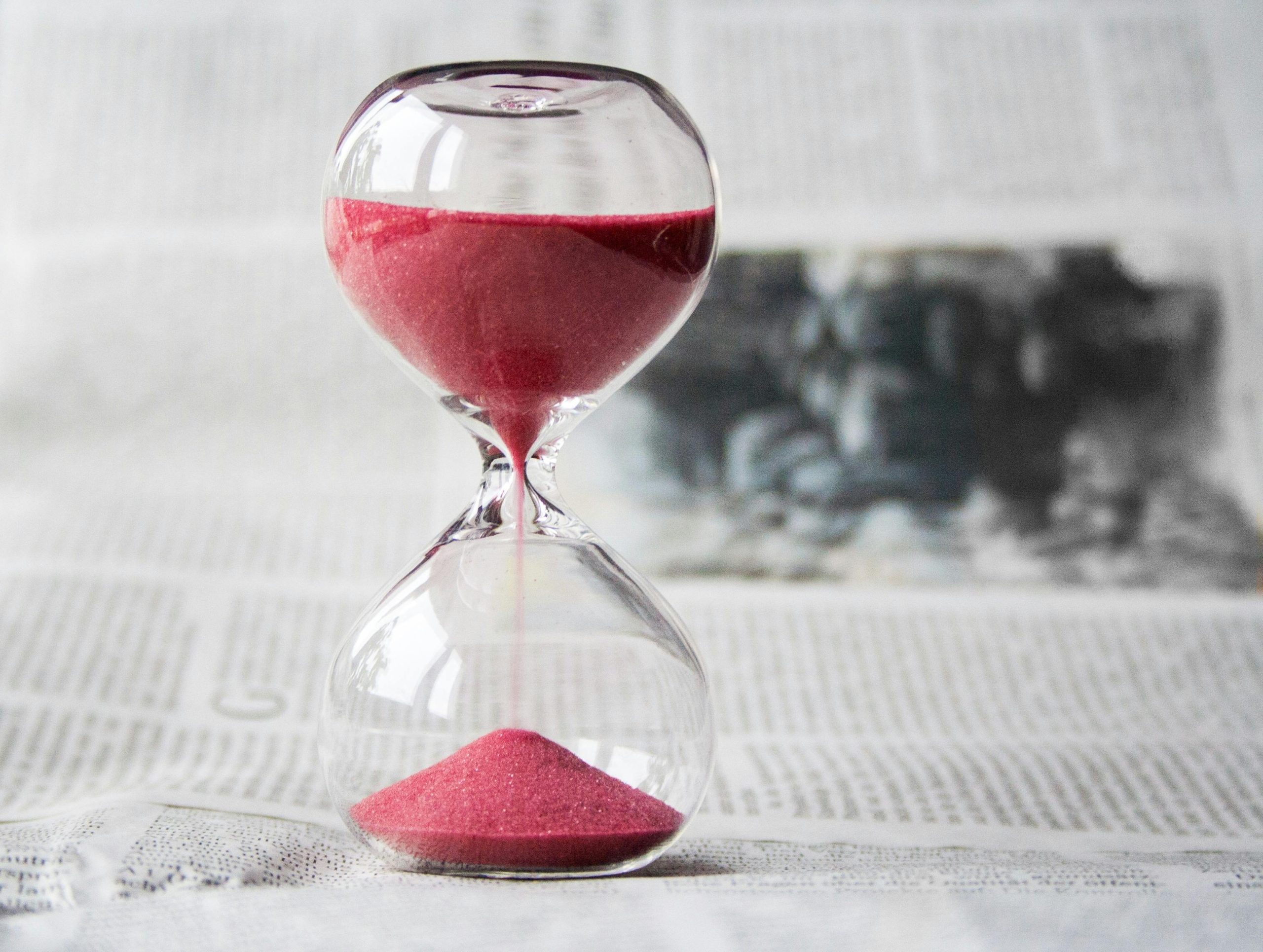 Hourglass filled with red sand